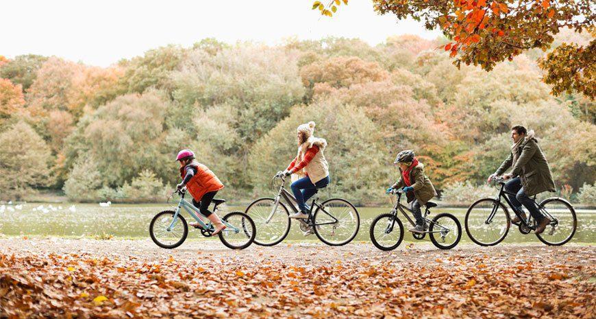 family cycling safely with hospital indemnity insurance