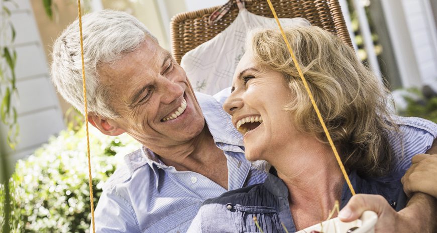 happy-couple-using-life-insurance-living-benefits