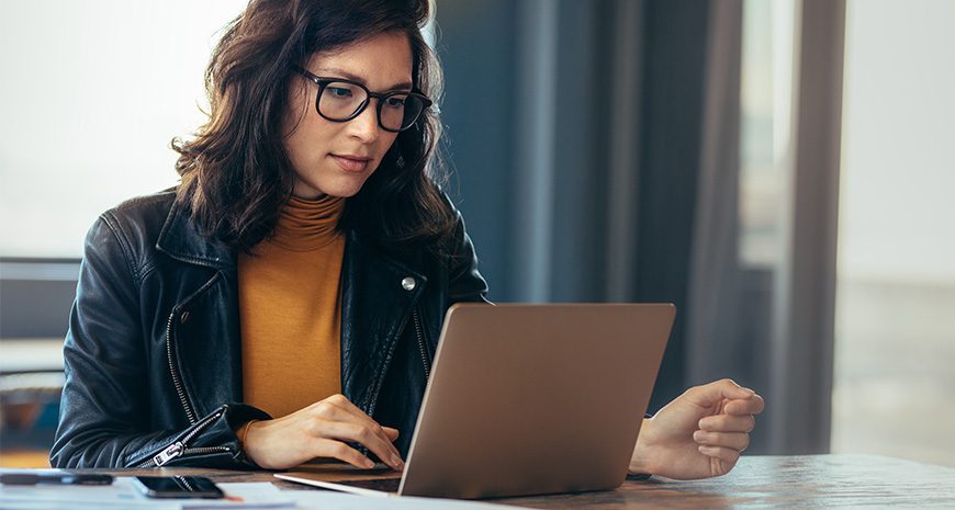 Women reviewing insurance policy on laptop