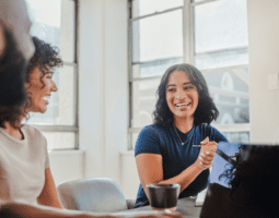 Employees speaking together during meeting