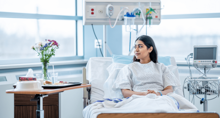 Women in hospital bed