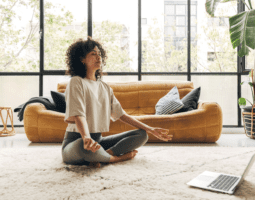 Woman taking virtual yoga meditation glass